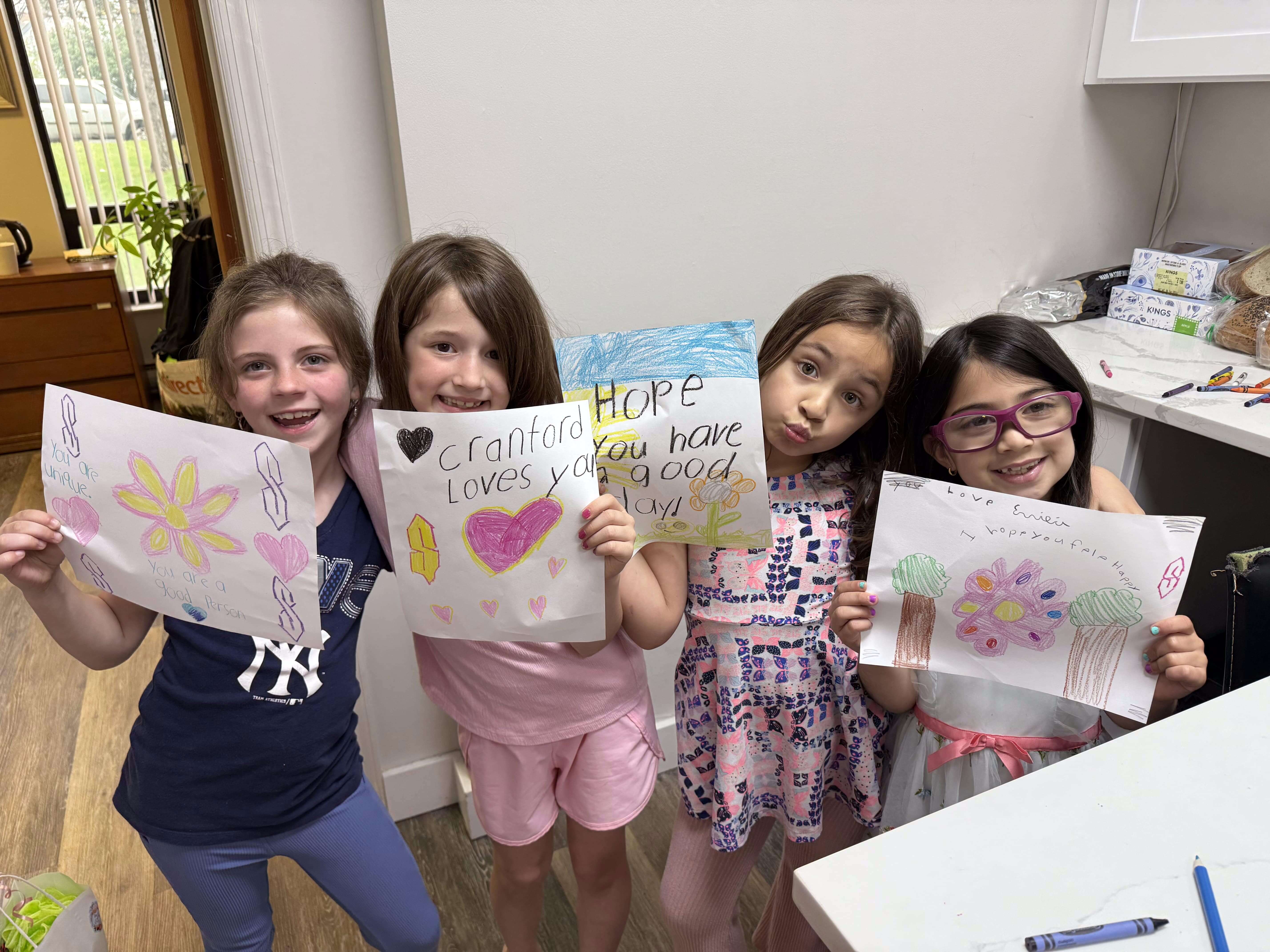Children volunteering at Cranford Family Care. Children volunteering at Cranford Family Care.